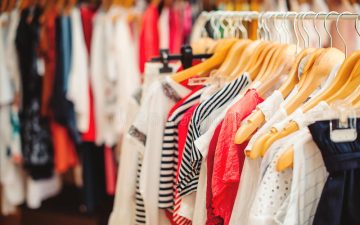 clothes-hangers-colorful-clothes-women-shop-summer-sale-73852501.jpg